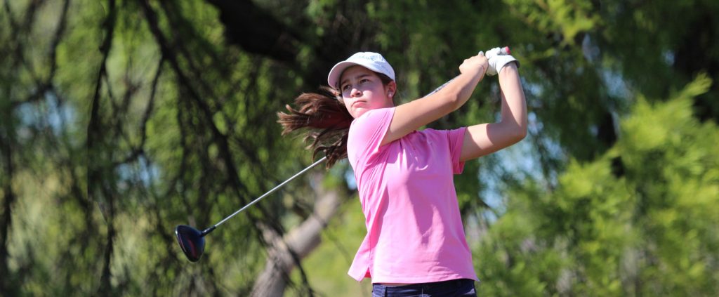 Golfer, Giovanna Fernandez, swings her golf club