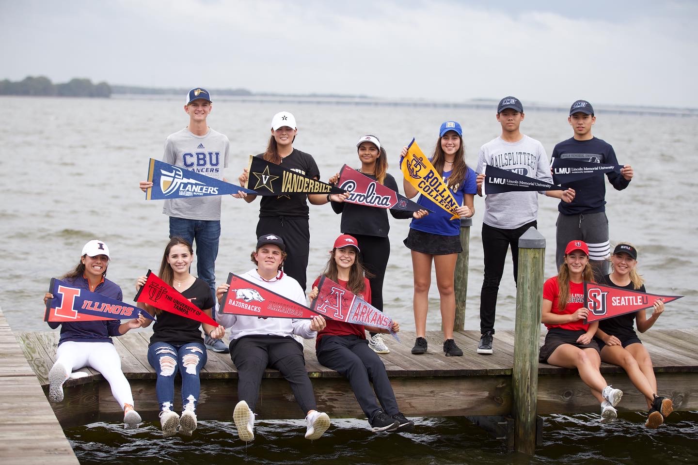 IJGA College Signers Class of 2021 holding college pennants