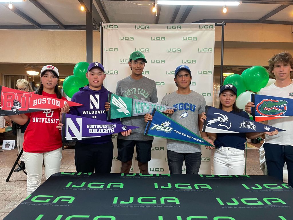 Five IJGA student golfers stand in a line holding pennants to the college they've been accepted to, including Boston, Northwester, North Texas, Florida Gulf Coast University, North Florida, and Florida University