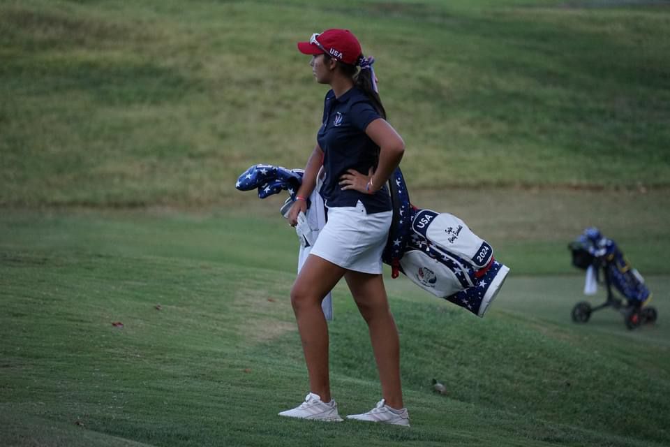 Sofia Cherif Essakali holding her clubs at the PING Junior Solheim Cup